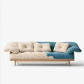 Sofá con respaldo asimétrico y cojines decorativos - beige/azul